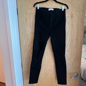 Abercrombie & Fitch. Super high rise skinny jeans. Ripped on front. Size 28.